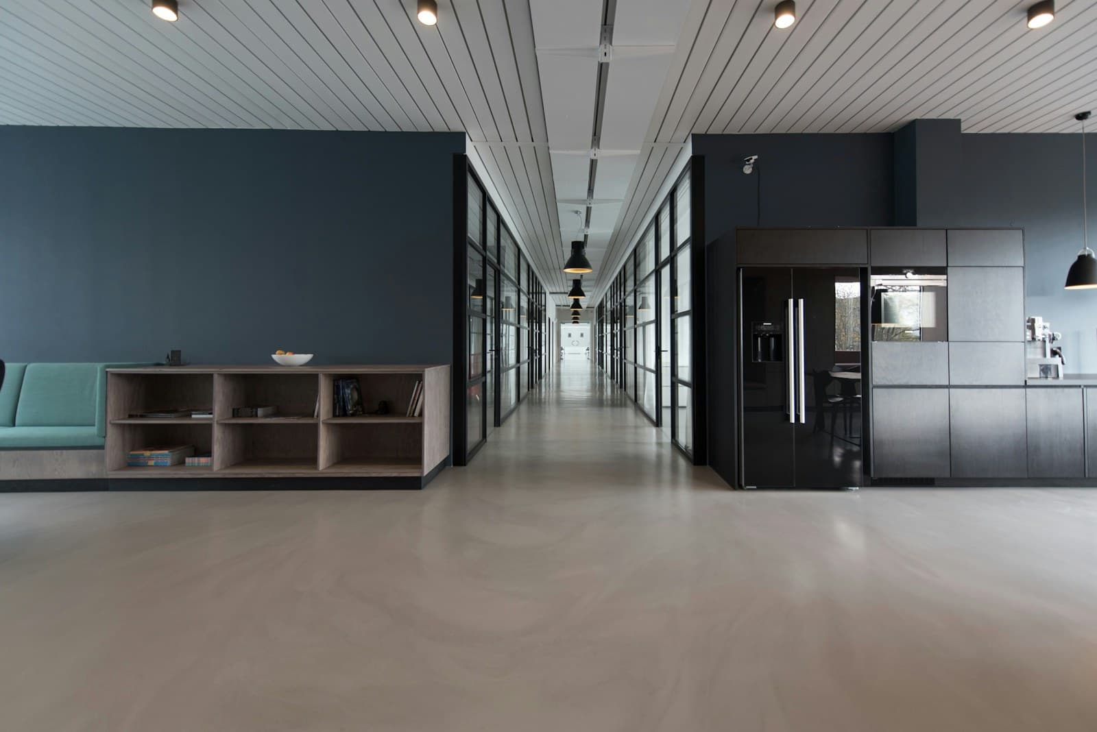 A modern content workspace with desks and computer screens