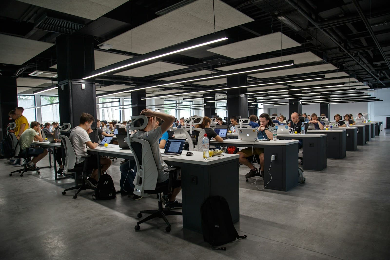 A communications team working together in an open office
