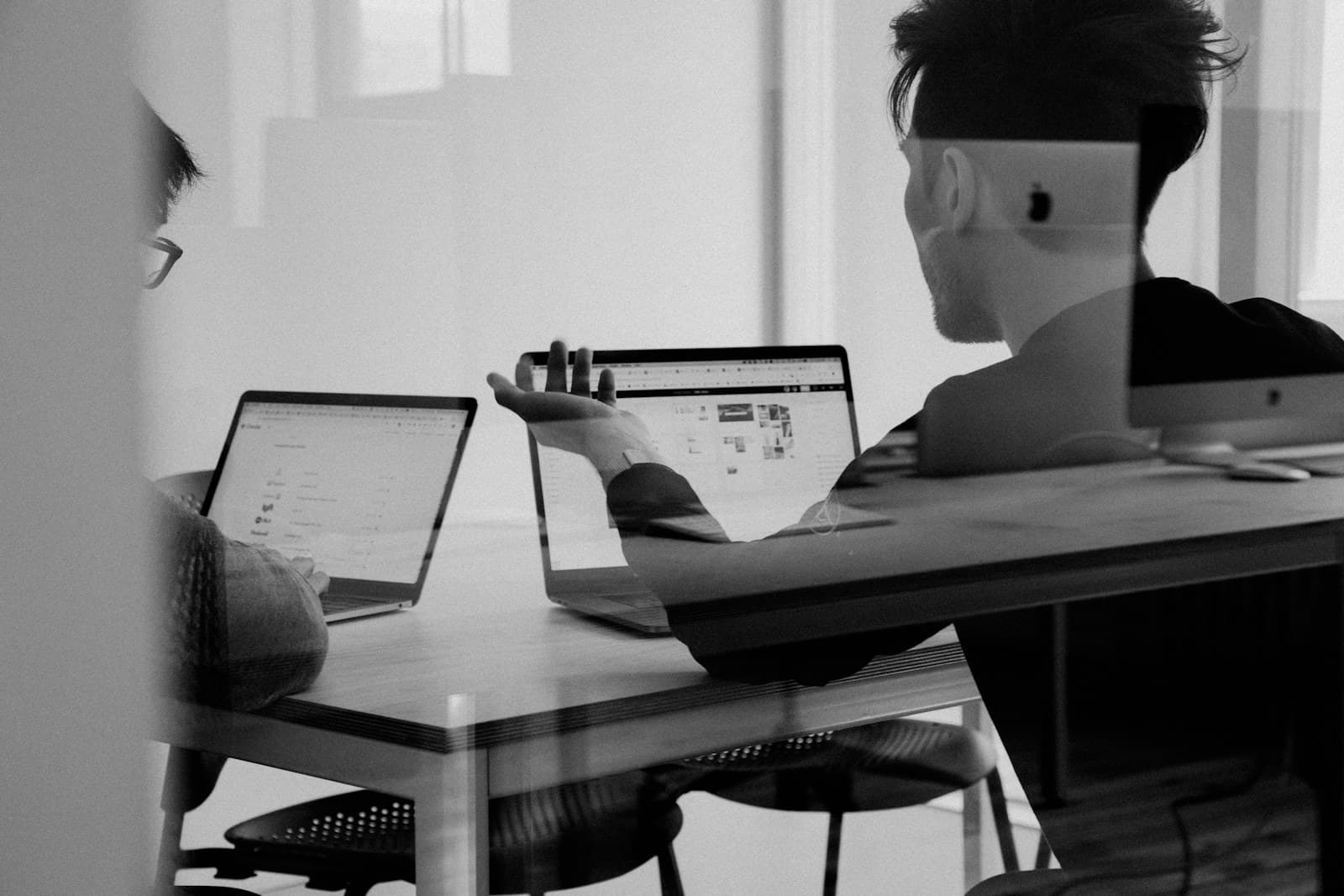 A marketing team reviewing performance charts on a screen